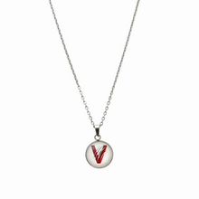 stainless steel circular pendant with the vines high school V logo on a curb chain