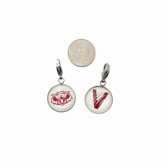 set of two stainless steel circular zipper pulls with the vines wildcat and v logos attached to a large lobster clasp