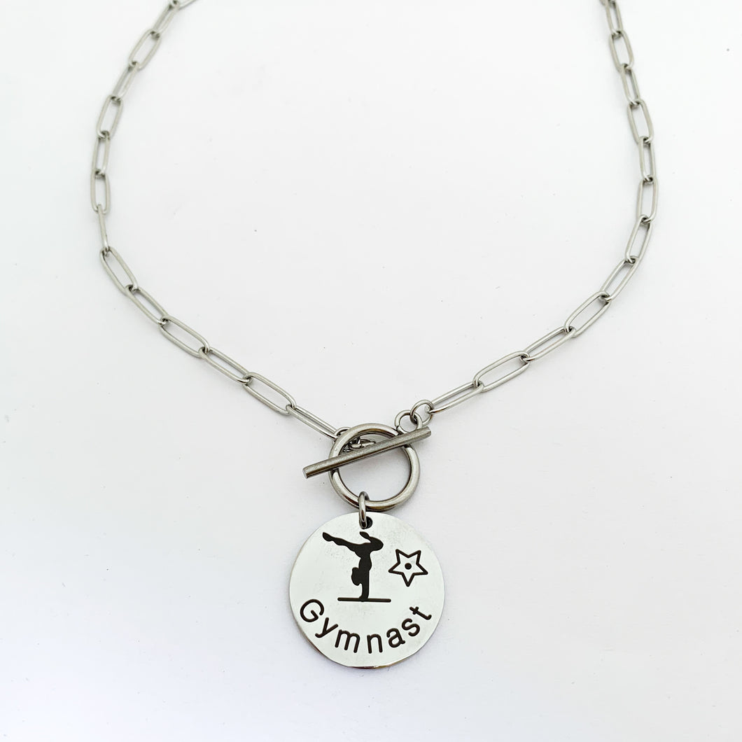 stainless steel gymnast pendant necklace on paperclip chain and toggle clasp