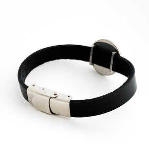 back view of black leather bracelet with stainless steel slide charm and clasp