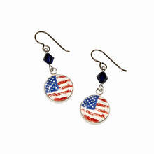 pair of circular flag charms accented with navy blue Swarovski crystals and niobium ear wires