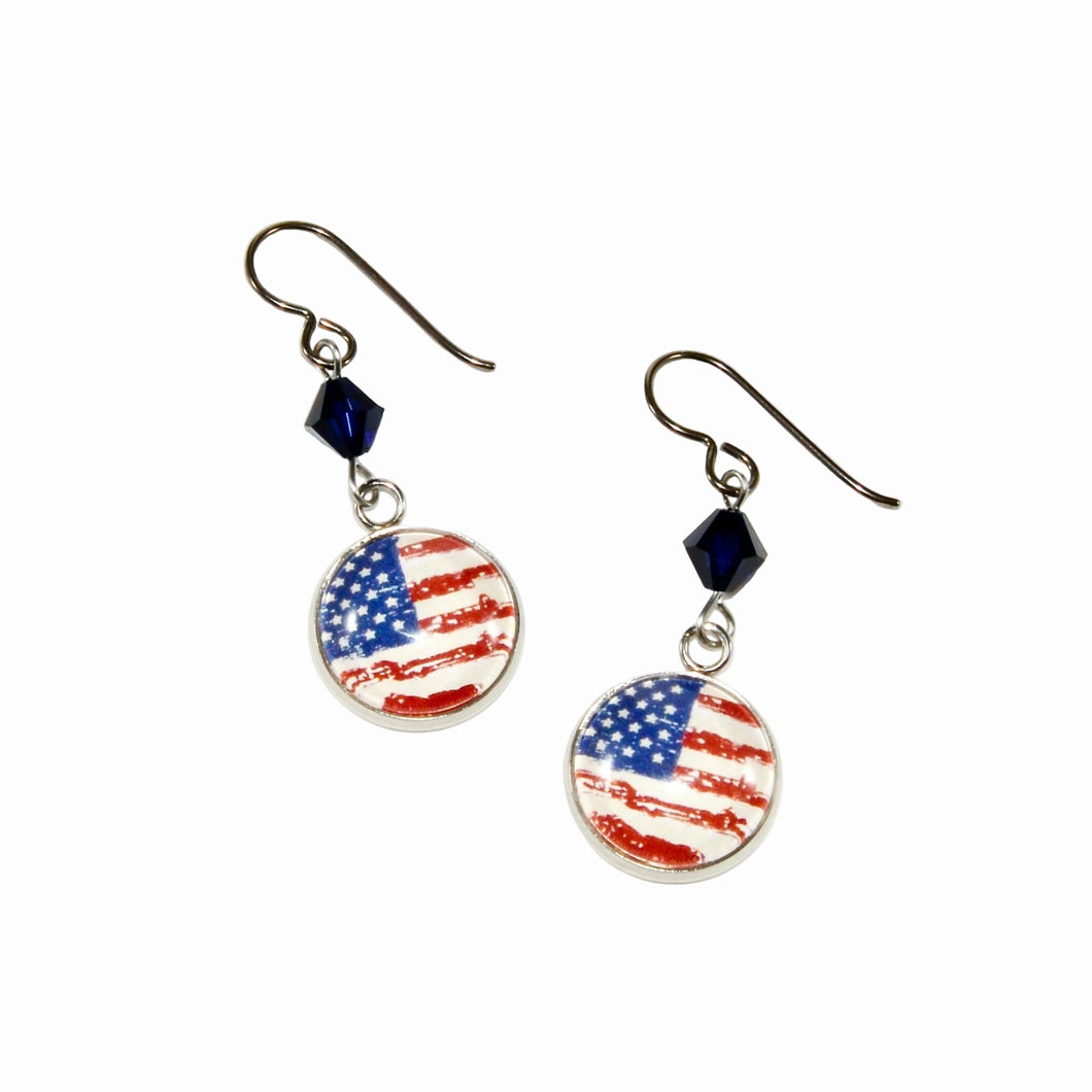 pair of circular flag charms accented with navy blue Swarovski crystals and niobium ear wires