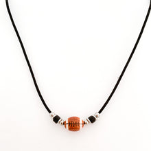 ceramic football bead necklace with black tube bead and stainless steel spacer beads accents strung on a black cotton cord