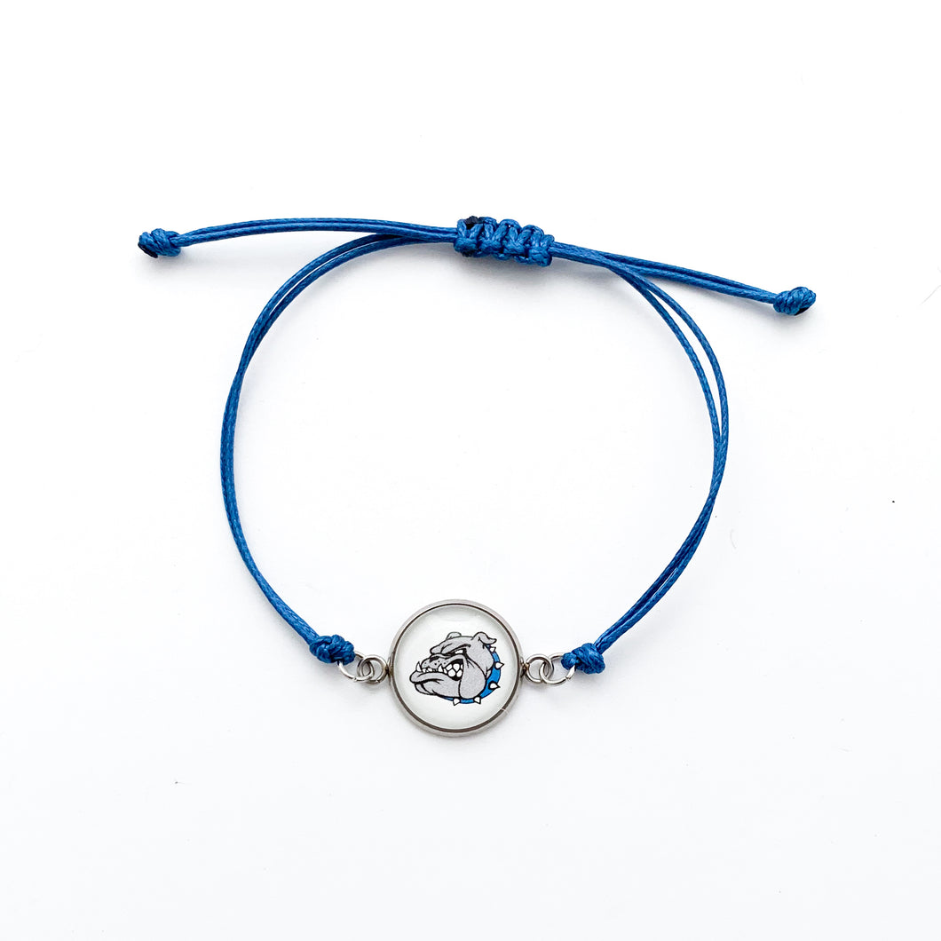 blue adjustable cord bracelet with a stainless steel circular charm with a Belgreen Bulldog ogo