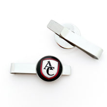 custom stainless steel tie clips with round cabochon charm featuring the Archbishop Curley high school logo on a white background
