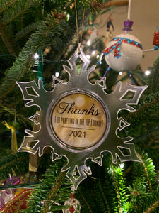 custom acrylic snowflake ornament hanging from christmas tree