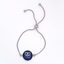 stainless steel adjustable slider bracelet with navy blue Sherwin Williams Women's club logo