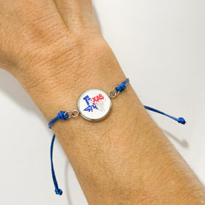 Texas Strong blue adjustable cord bracelet on female wrist