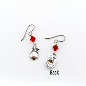 front and back view of silver "I Dig" volleyball charm earrings with red Swarovski crystal bicone beads