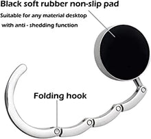 diagram of the bottom of a silver folding bag and purse hook with black soft rubber non slip pad text
