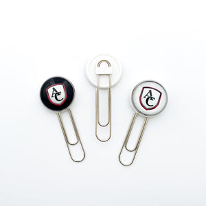 custom cabochon paperclip bookmarks featuring the Archbishop Curley high school logo in black and white