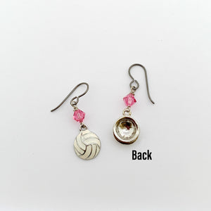 front and back view of white enamel volleyball charm earrings with pink Swarovski crystal bead accents