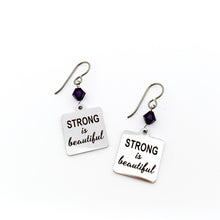 stainless steel charm earrings with laser engraved with Strong is Beautiful accented with 6 mm purple Swarovski crystal bicone beads
