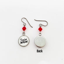 front and back view of swim mom charm earrings with red swarovski crystal beads