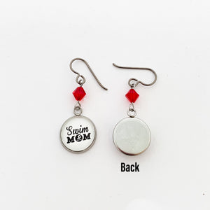 front and back view of swim mom charm earrings with red swarovski crystal beads